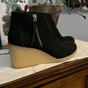 Pair of Black Tom’s Womens boots size 10.